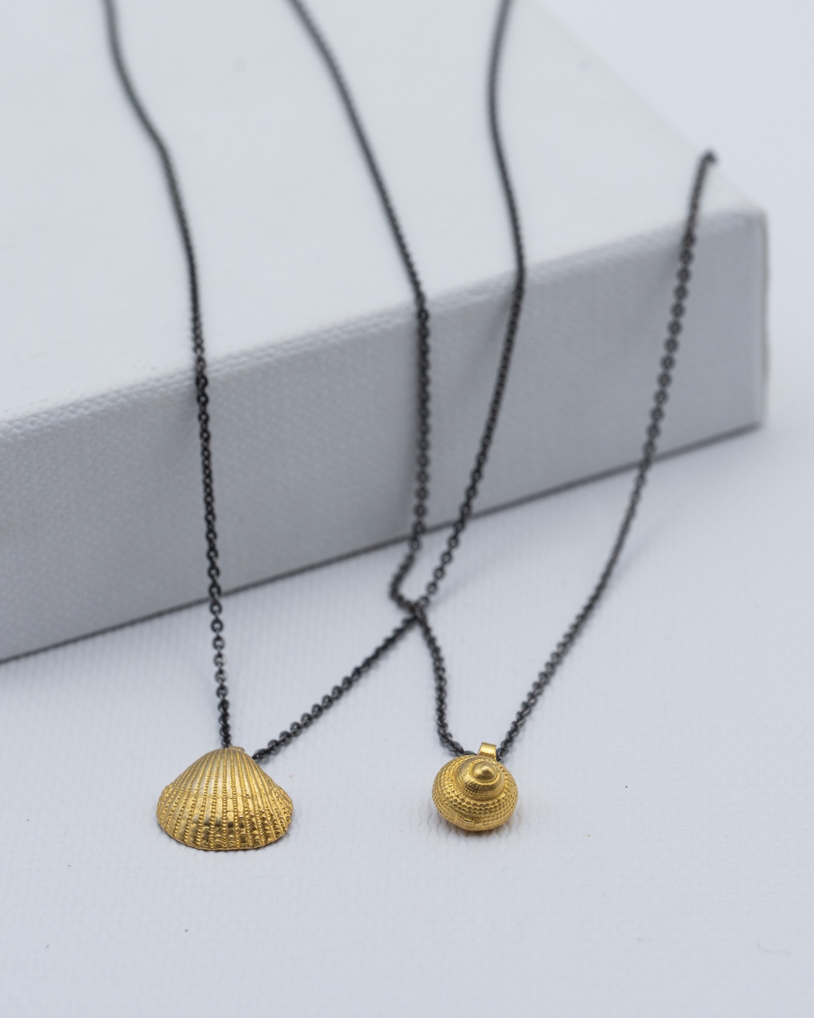 musle jako privesek zlato